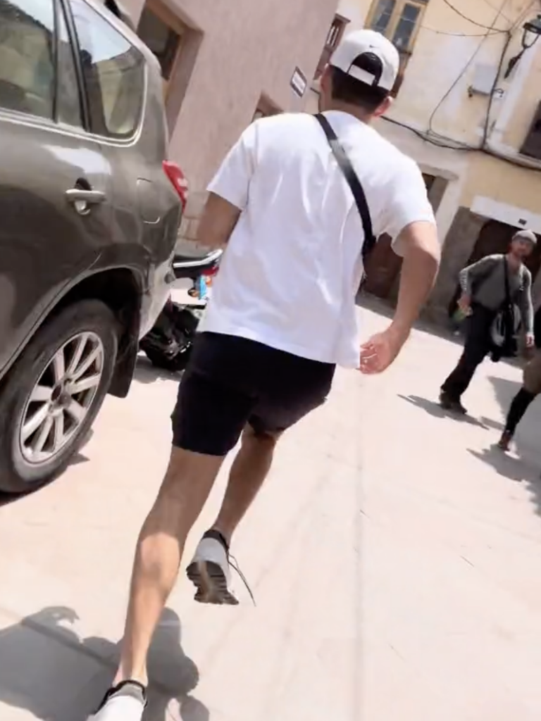 man running in a TikTok video